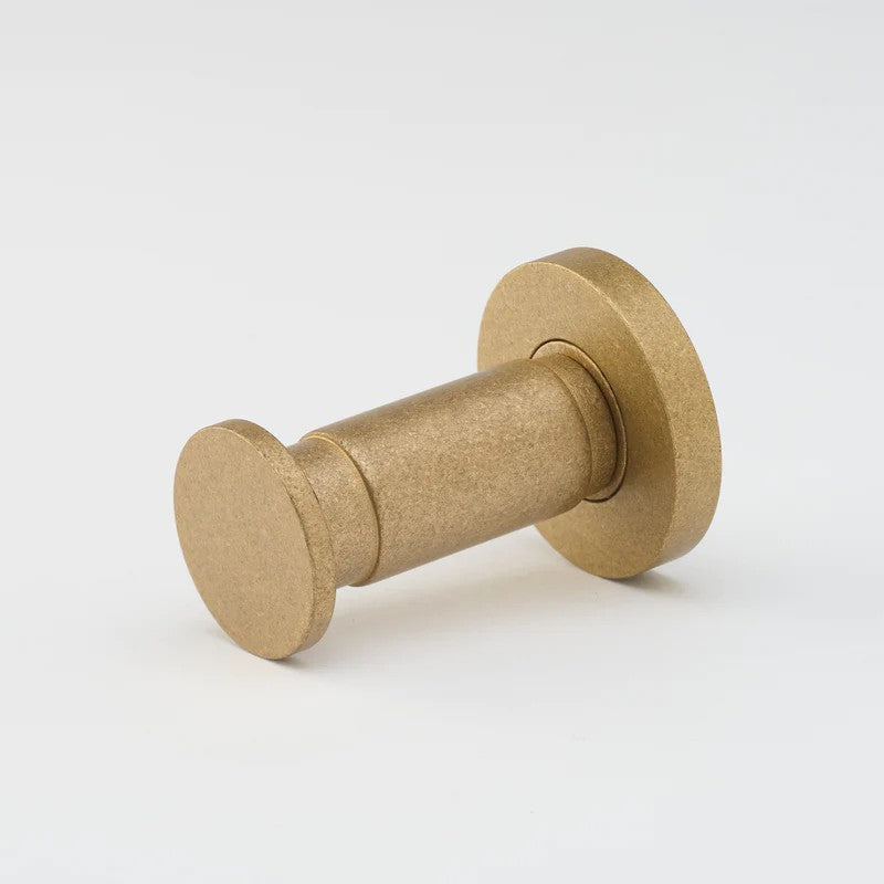 Lo & Co Lola towel hook, architectural hardware in matte bronze finish, mounted on wall for towel hanging and organization.