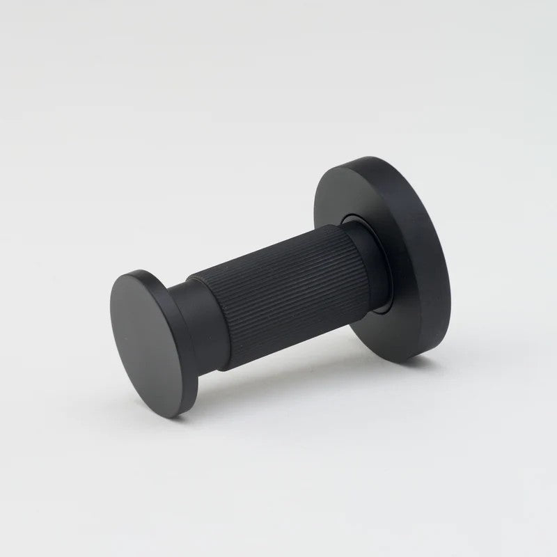Lo & Co Linear Towel Hook in matte black, architectural hardware mounted on wall for towel storage and organization.