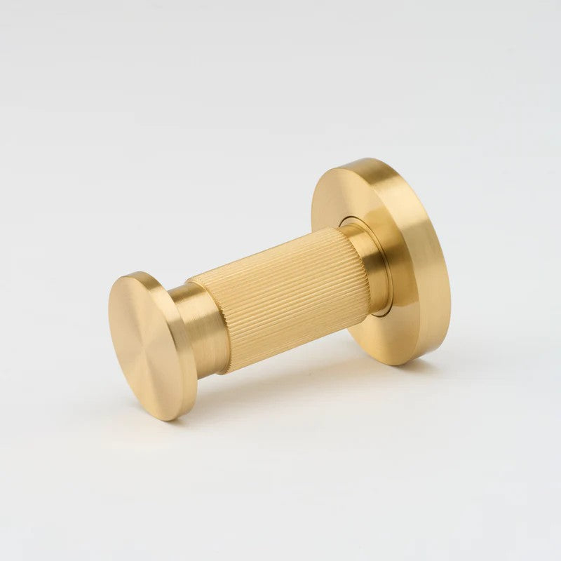 Lo & Co Linear Towel Hook in architectural hardware style, mounted on wall with a sleek, modern design for bathroom or kitchen use.