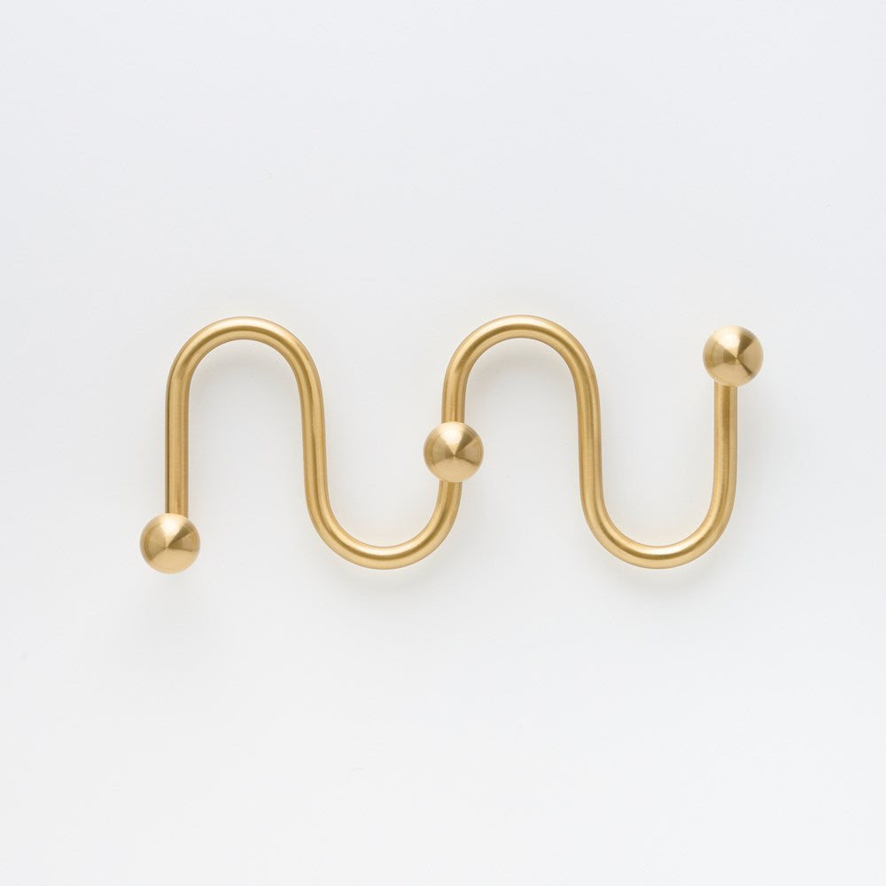 Large Lo & Co Sphere Hook XL in architectural hardware style, made by Lo & Co Interiors, mounted on a wall with a sleek finish.