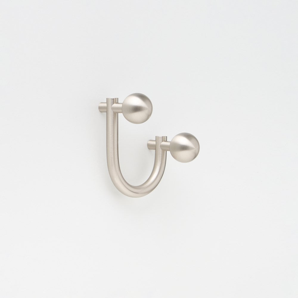 Small Lo & Co Sphere Hook in brass finish, architectural hardware with a sleek, rounded design for modern interior decor.