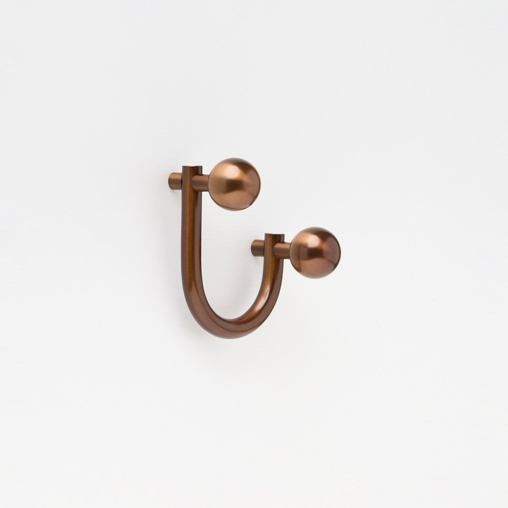 Small Lo & Co Sphere Hook from Lo & Co Interiors, showcasing a sleek architectural hardware design in a bronze finish.