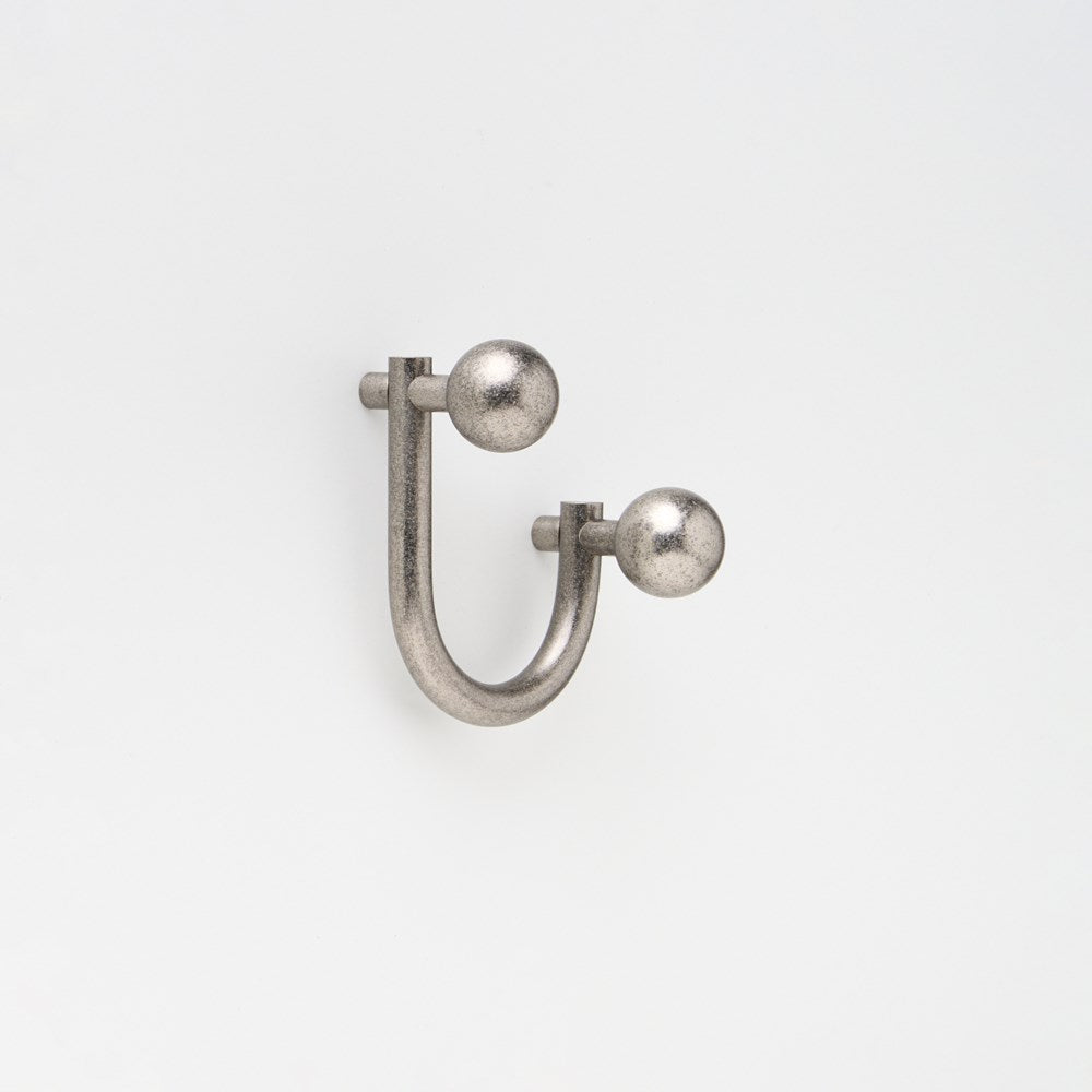 Small Lo & Co Sphere Hook from Lo & Co Interiors, showcasing sleek architectural hardware design on a wall mount.