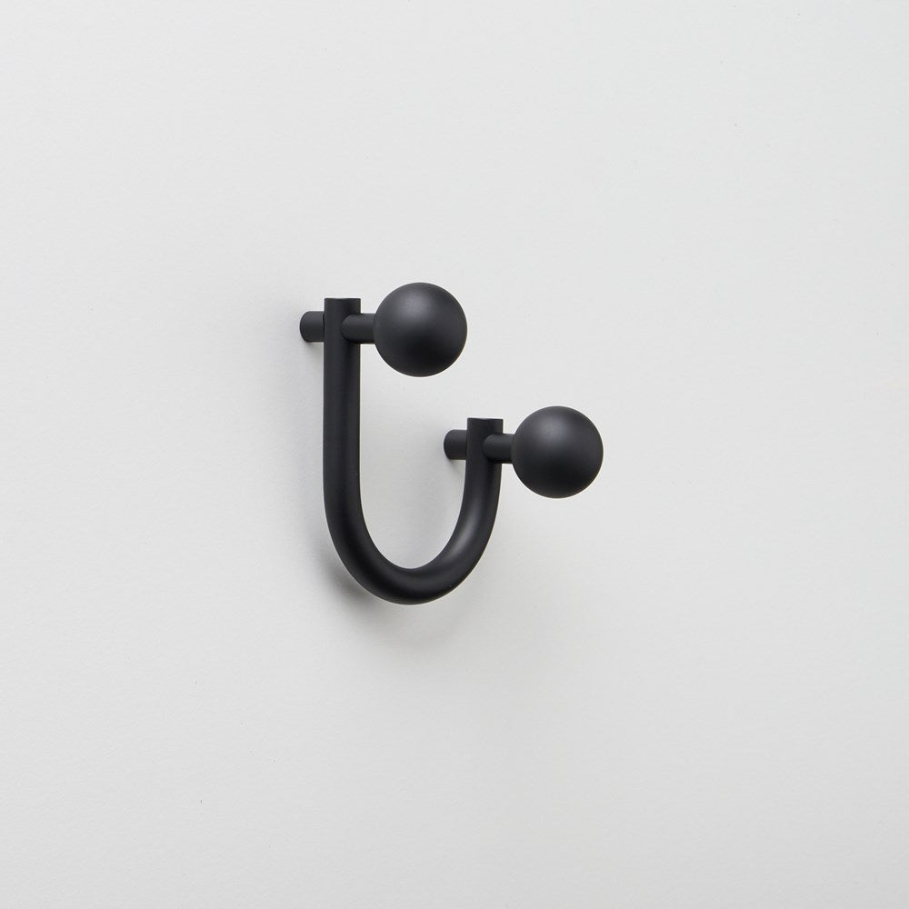 Small Lo & Co Sphere Hook from Lo & Co Interiors showing a sleek, modern architectural hardware hook with a spherical design.