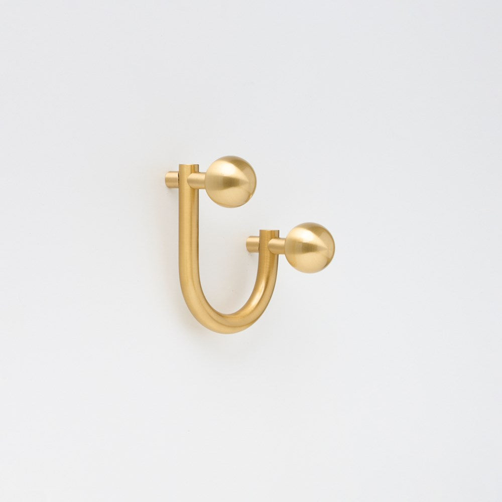 Small Lo & Co Sphere Hook from Lo & Co Interiors, showcasing a sleek architectural hardware design on a neutral background.