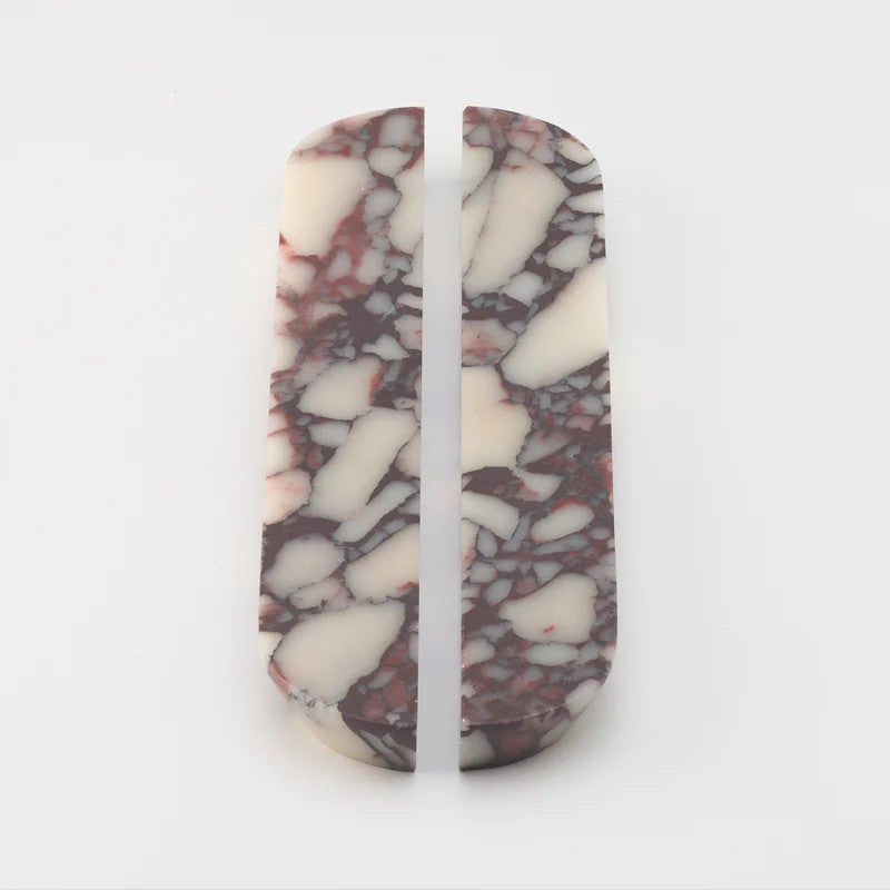 Pair of Lo & Co Interiors large marble dot cabinet handles with black hardware, designed for stylish kitchen or furniture drawers.