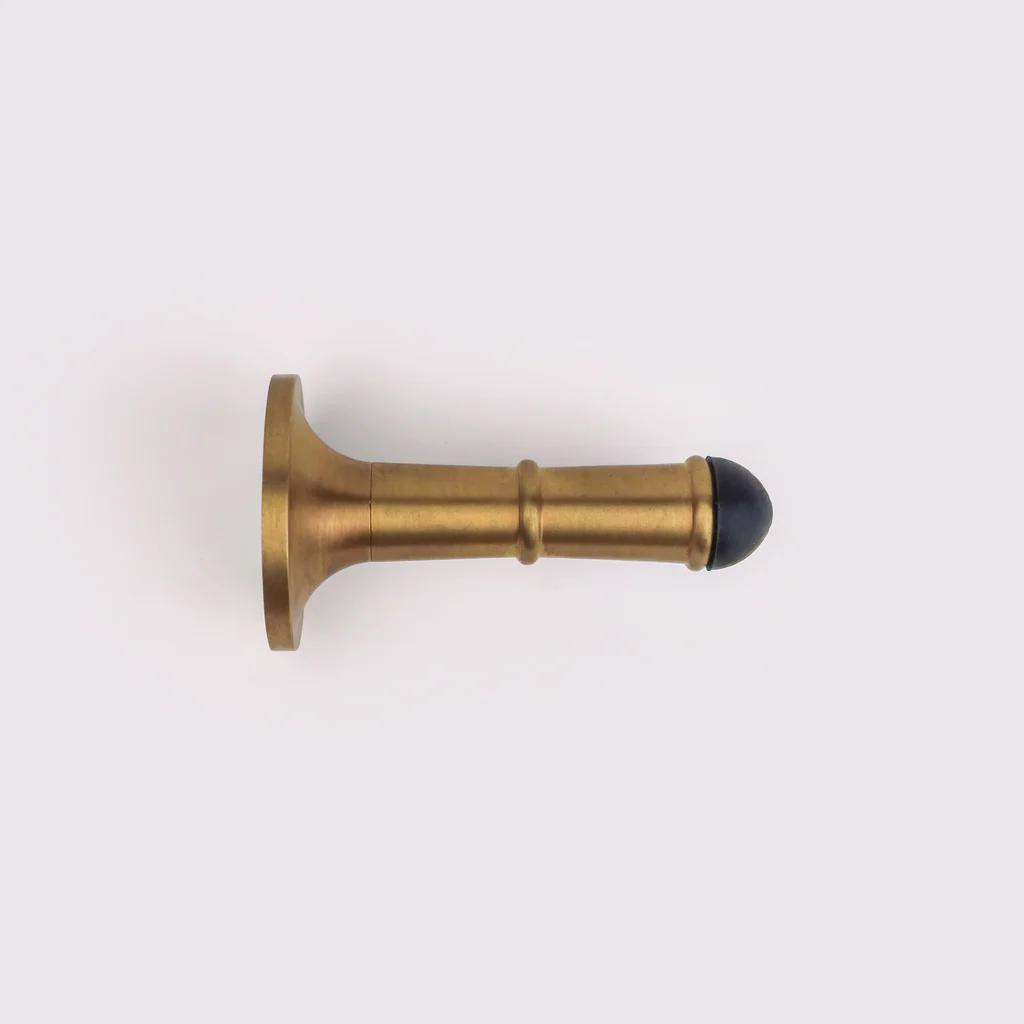 Wall Door Stop - Acid Washed Brass in Acid Washed Brass