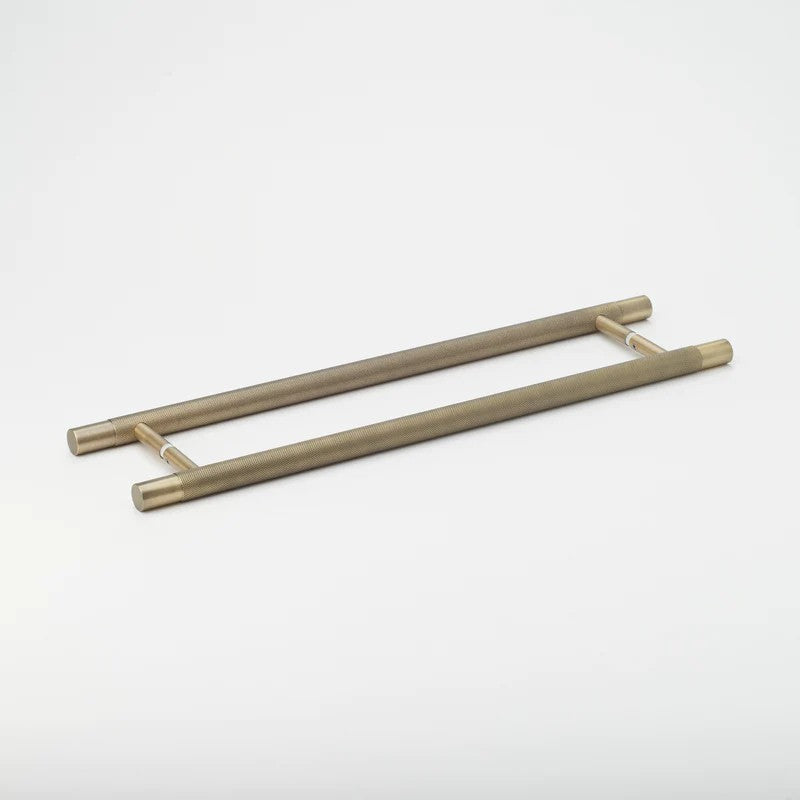 Black Lo & Co Kintore Entry Pull handle on door, crafted from architectural hardware with sleek, modern design by Lo & Co Interiors.