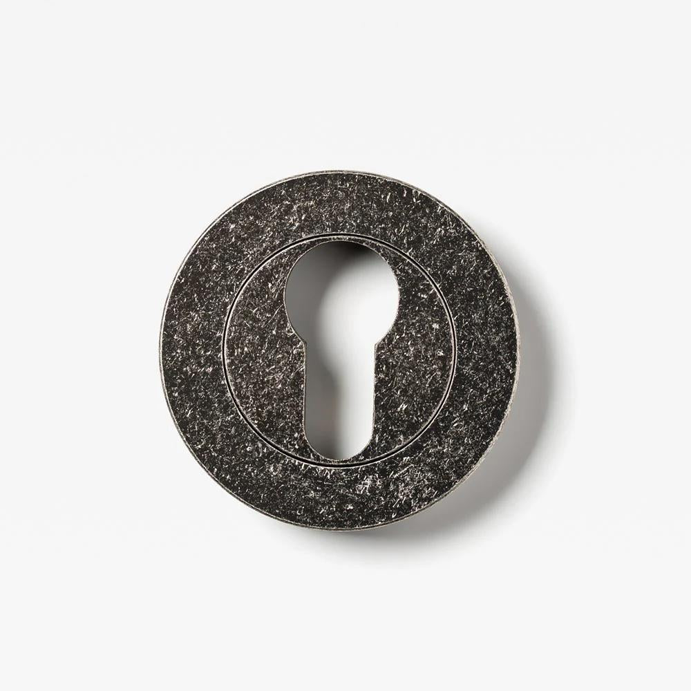 Lo & Co Round Euro Cylinder Escutcheon in matte nickel, showcasing its sleek circular design for architectural hardware applications.