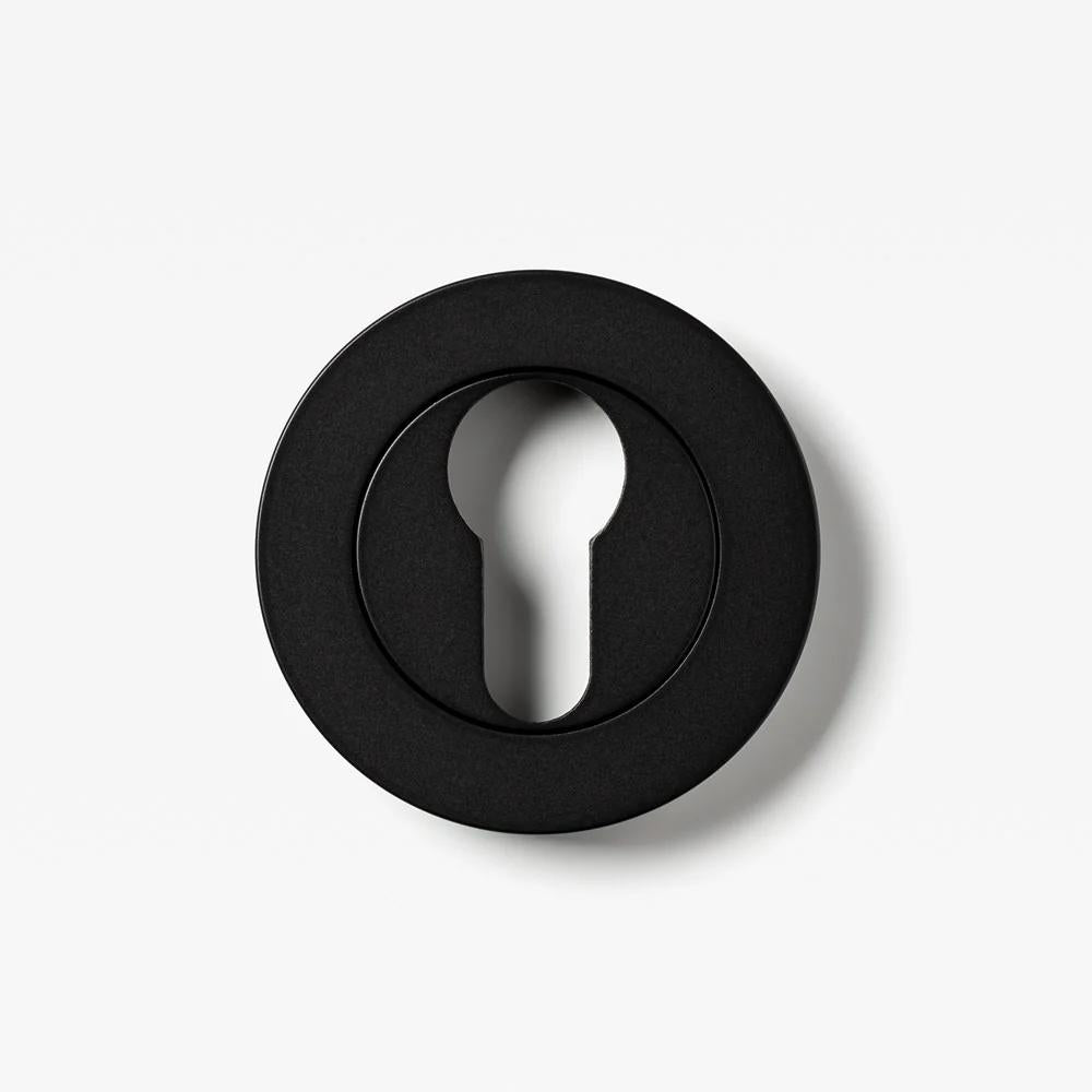Lo & Co Round Euro Cylinder Escutcheon in architectural hardware, showing a sleek, circular metal cover for euro lock cylinders.