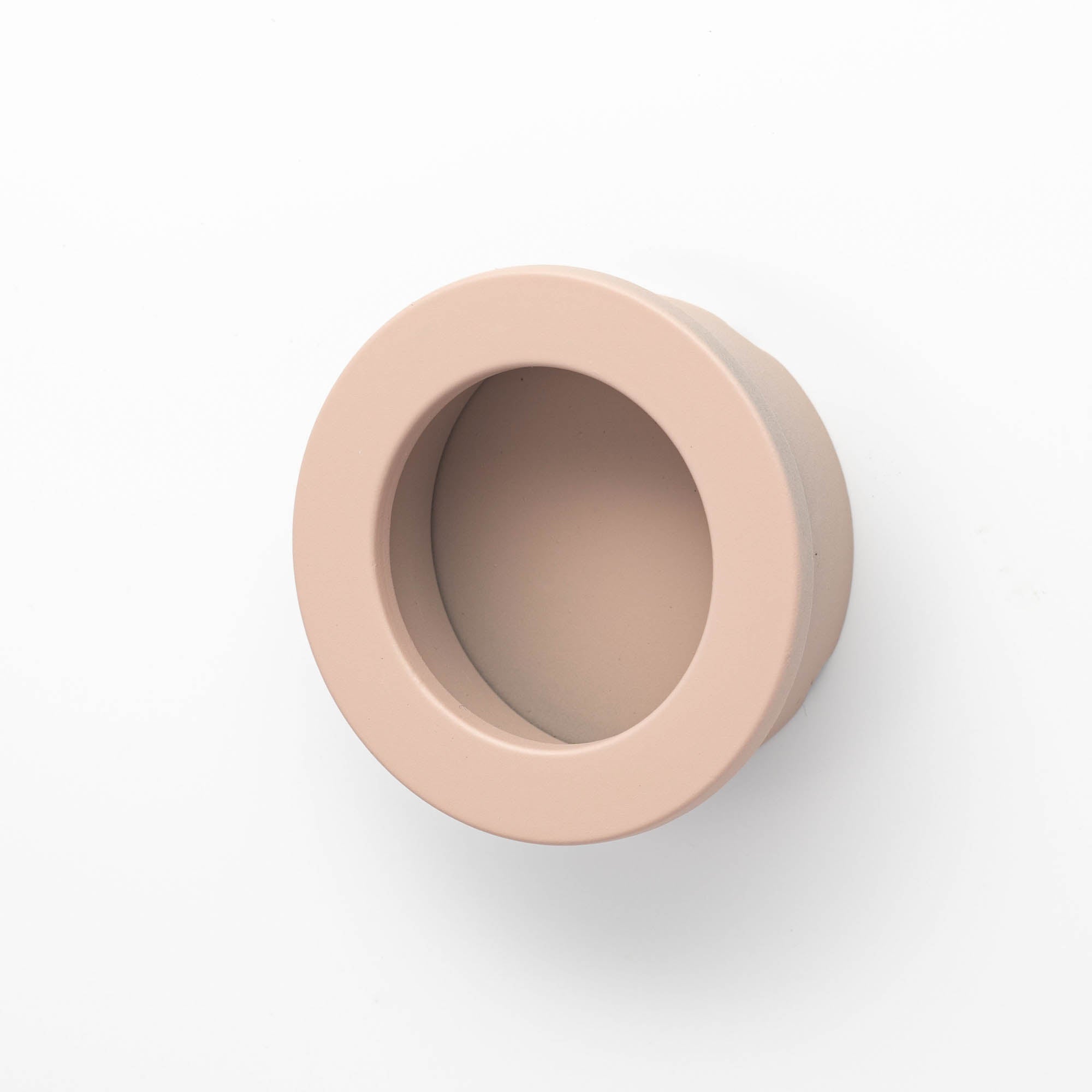 Castella round flush pull handle, 40mm diameter, in a sleek modern finish, designed for cabinetry or furniture applications.