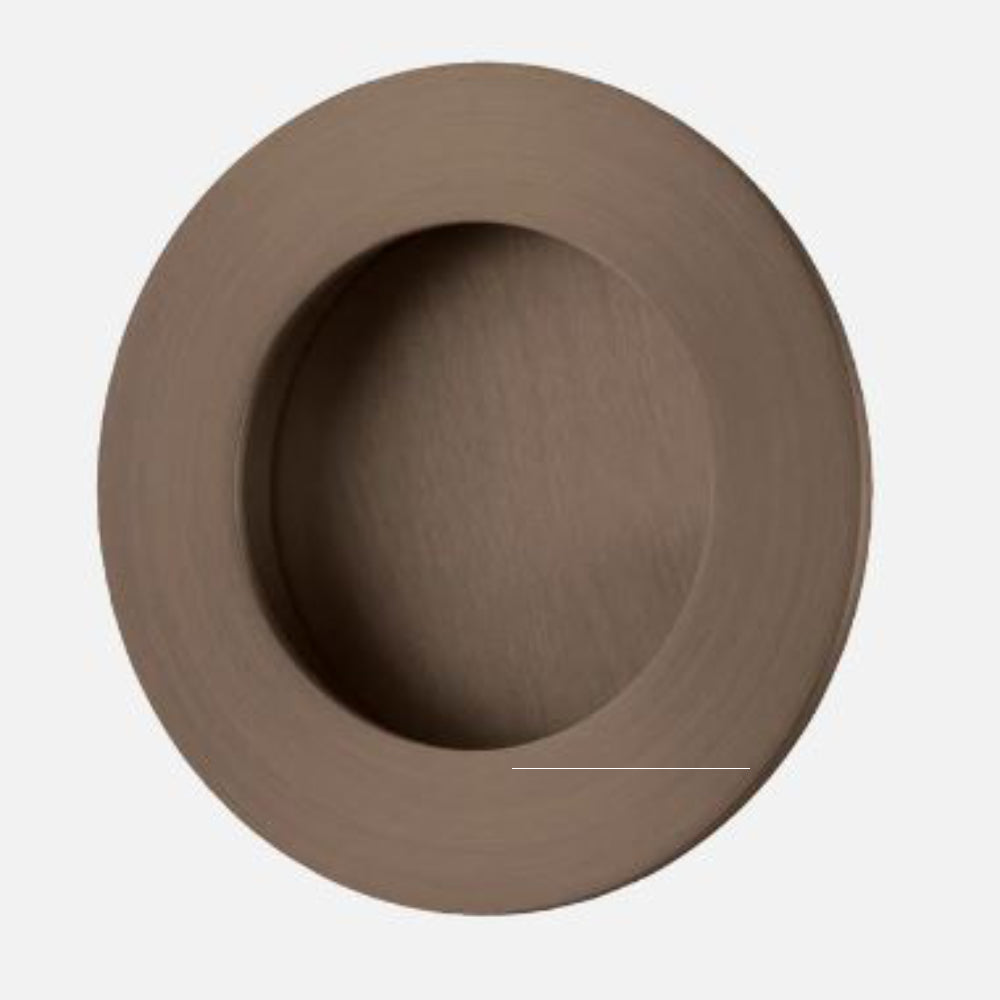 Round designer flush pulls by Iver, architectural hardware, installed on a door showcasing sleek, modern round flush pull handles.