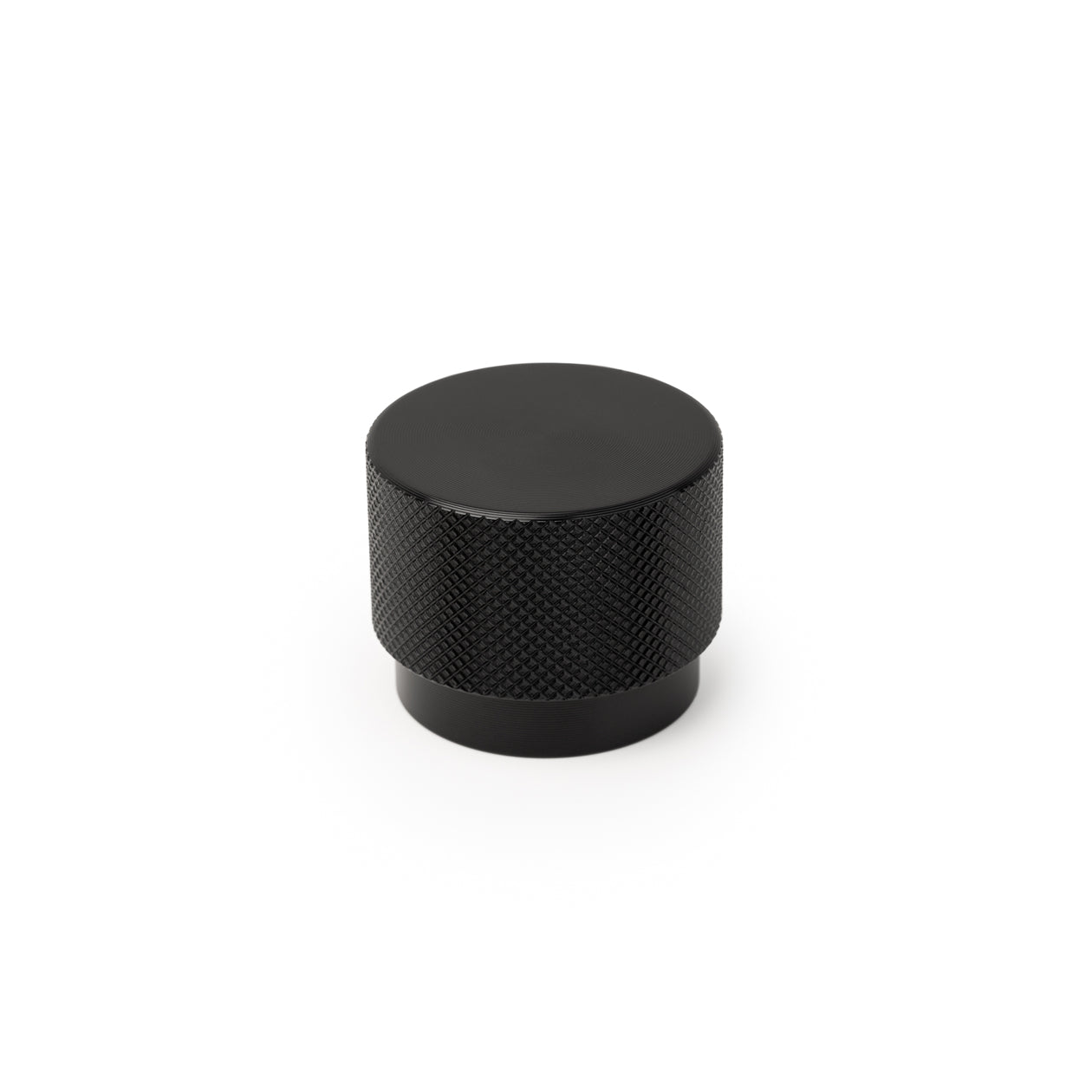 Momo GRAF cabinet knob in black with sleek modern design, mounted on a wooden cabinet door.