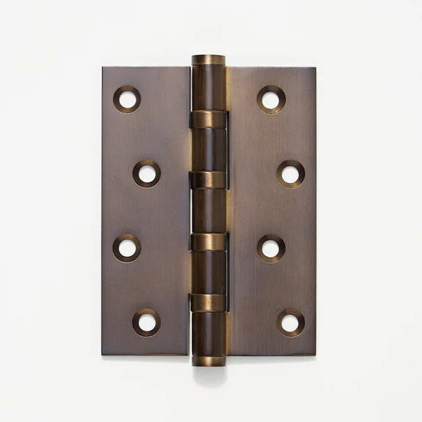 Lo & Co Interiors hinge, 100mm x 75mm architectural hardware with brass finish, showcasing its sturdy design and polished surface.