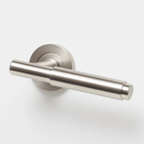 Lo & Co Lola Lever handle in brushed nickel finish, showcasing a sleek modern design on a door handle.