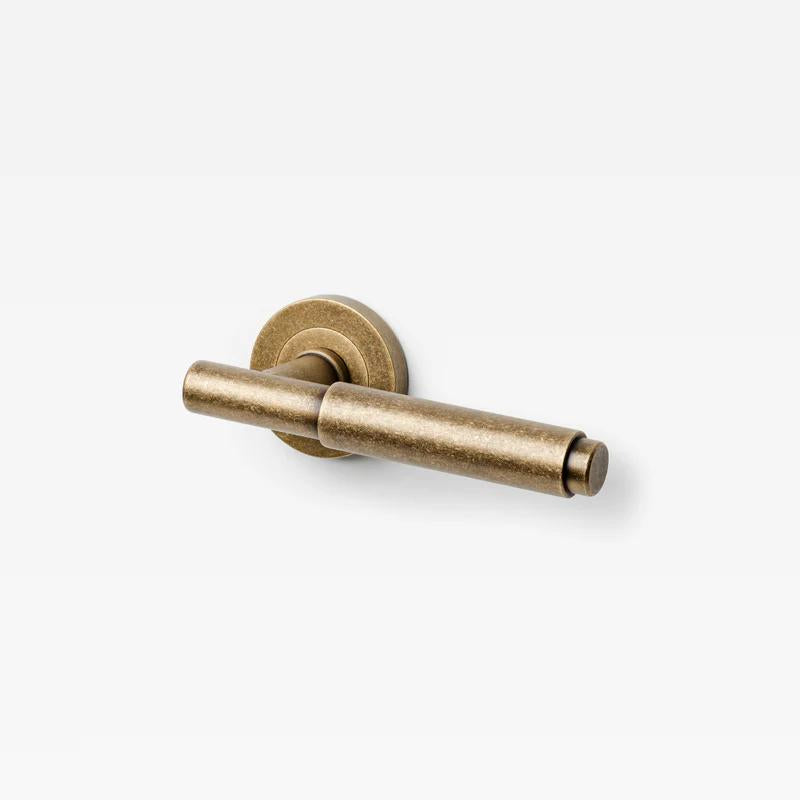 Lo & Co Lola Lever door handle in brushed bronze finish, featuring a sleek modern design with a rounded lever and mounting plate.