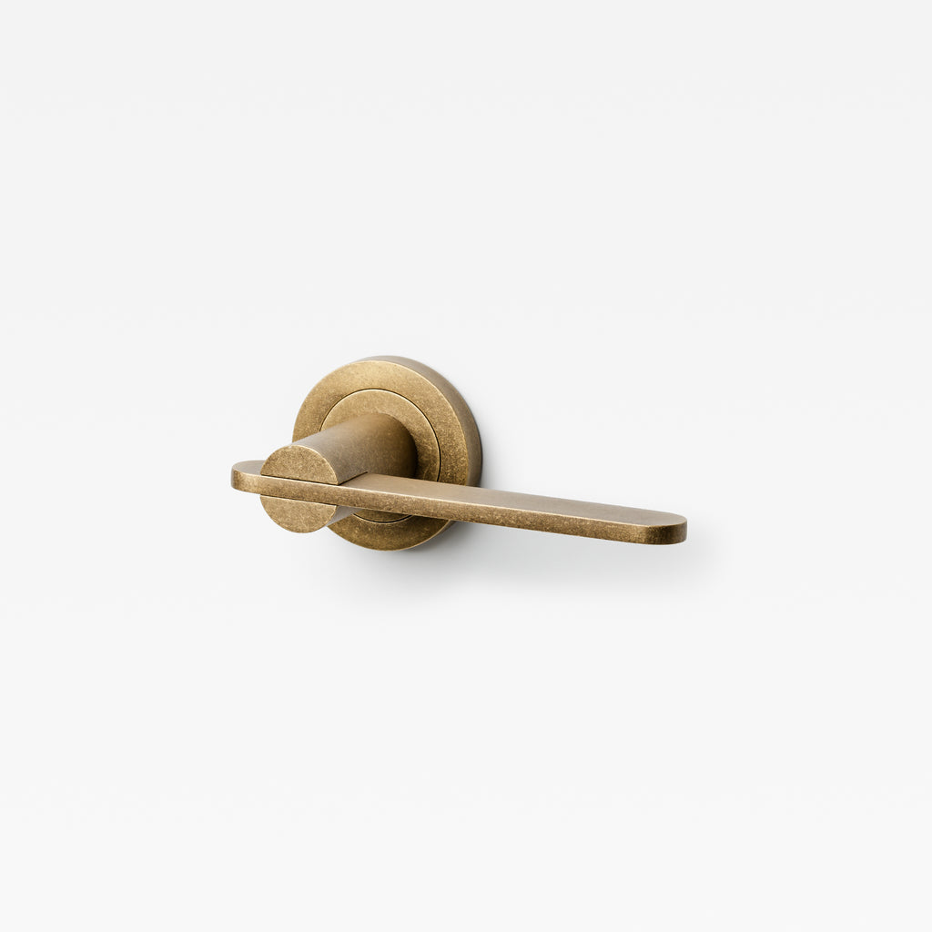 Lo & Co Interiors Intersect Lever door handle in brushed bronze finish, showing sleek design and modern hardware details.