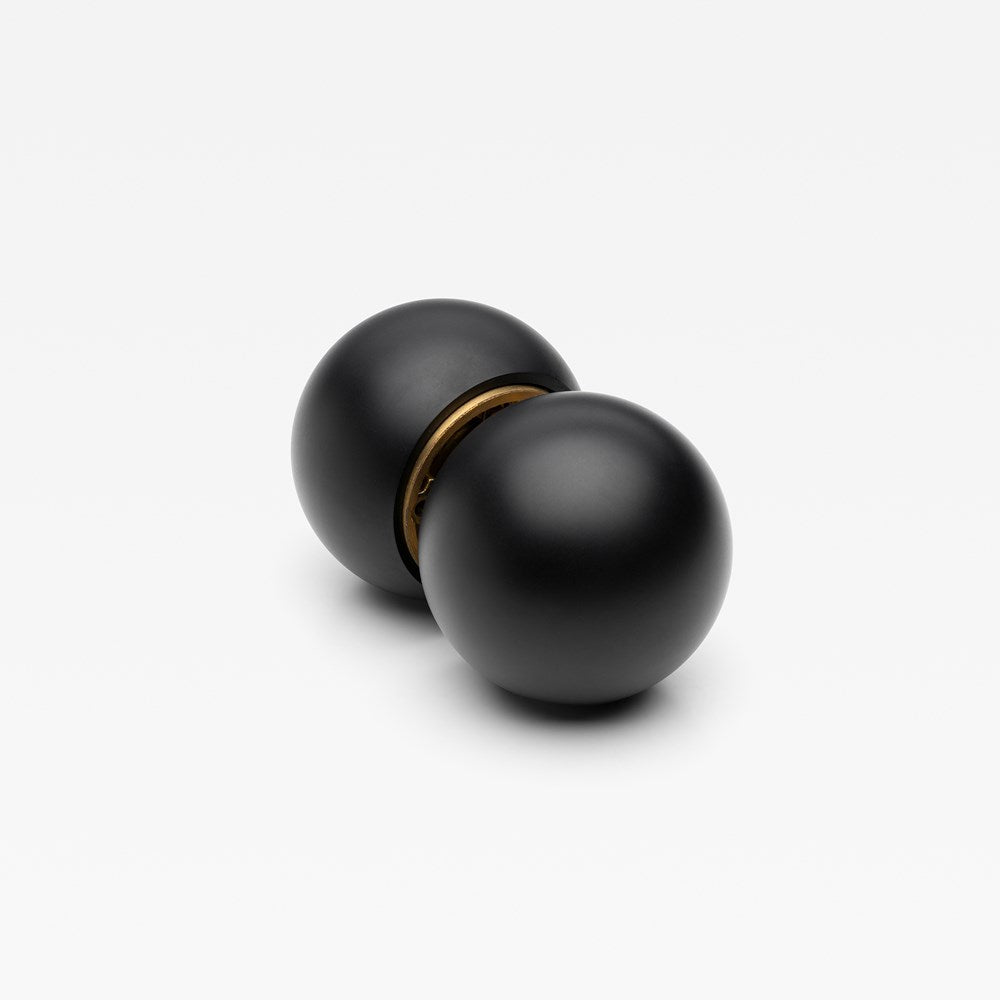 Lo & Co Interiors Sphere Passage Set featuring sleek, modern door hardware with spherical handles and matching passage levers.