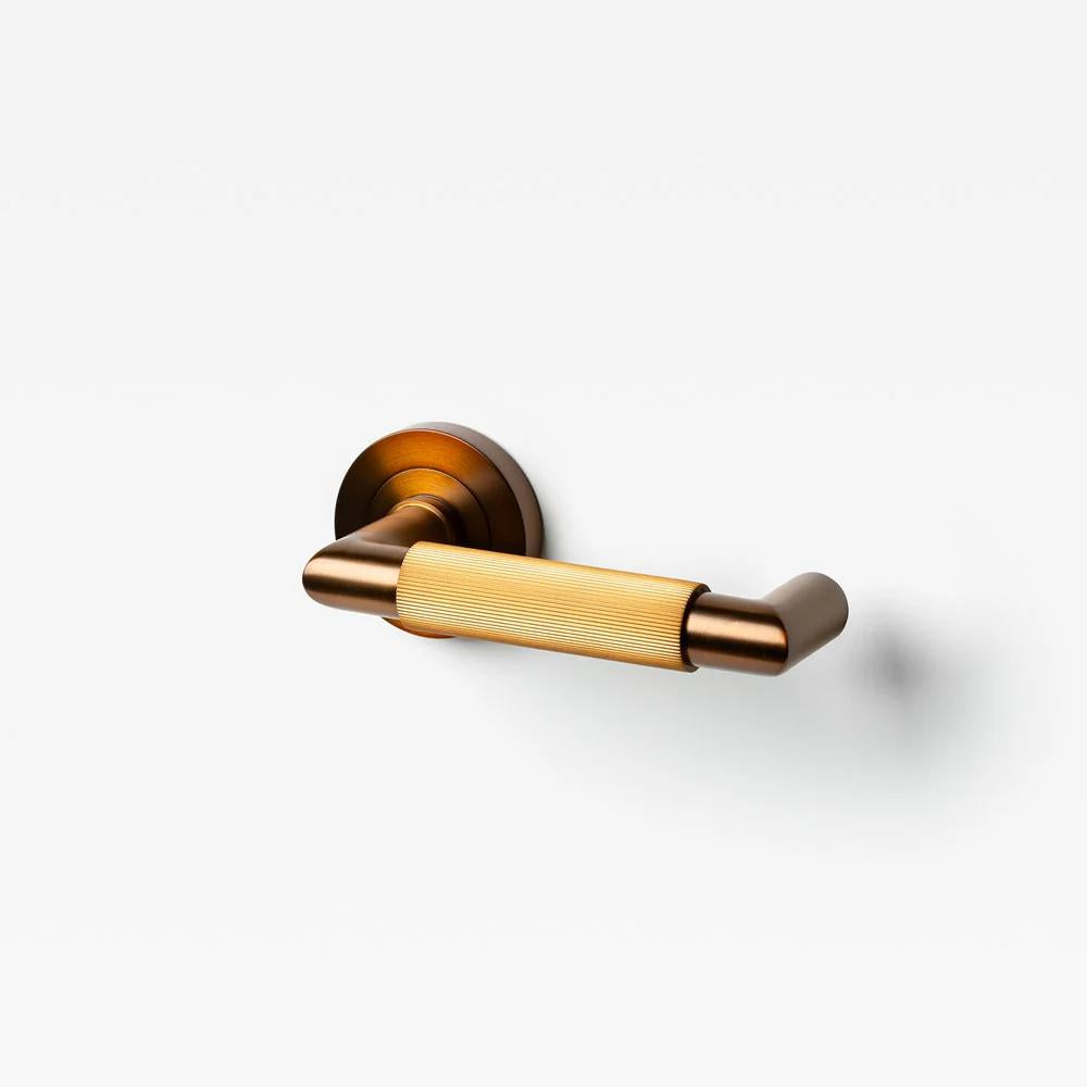 Lo & Co Linear Knurled Return Lever in brushed metal finish, showing the detailed textured handle and mounting base.