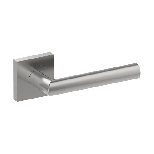 Stainless steel CETINA door handle by Style Finish Doorware installed on a door, featuring a sleek modern design.