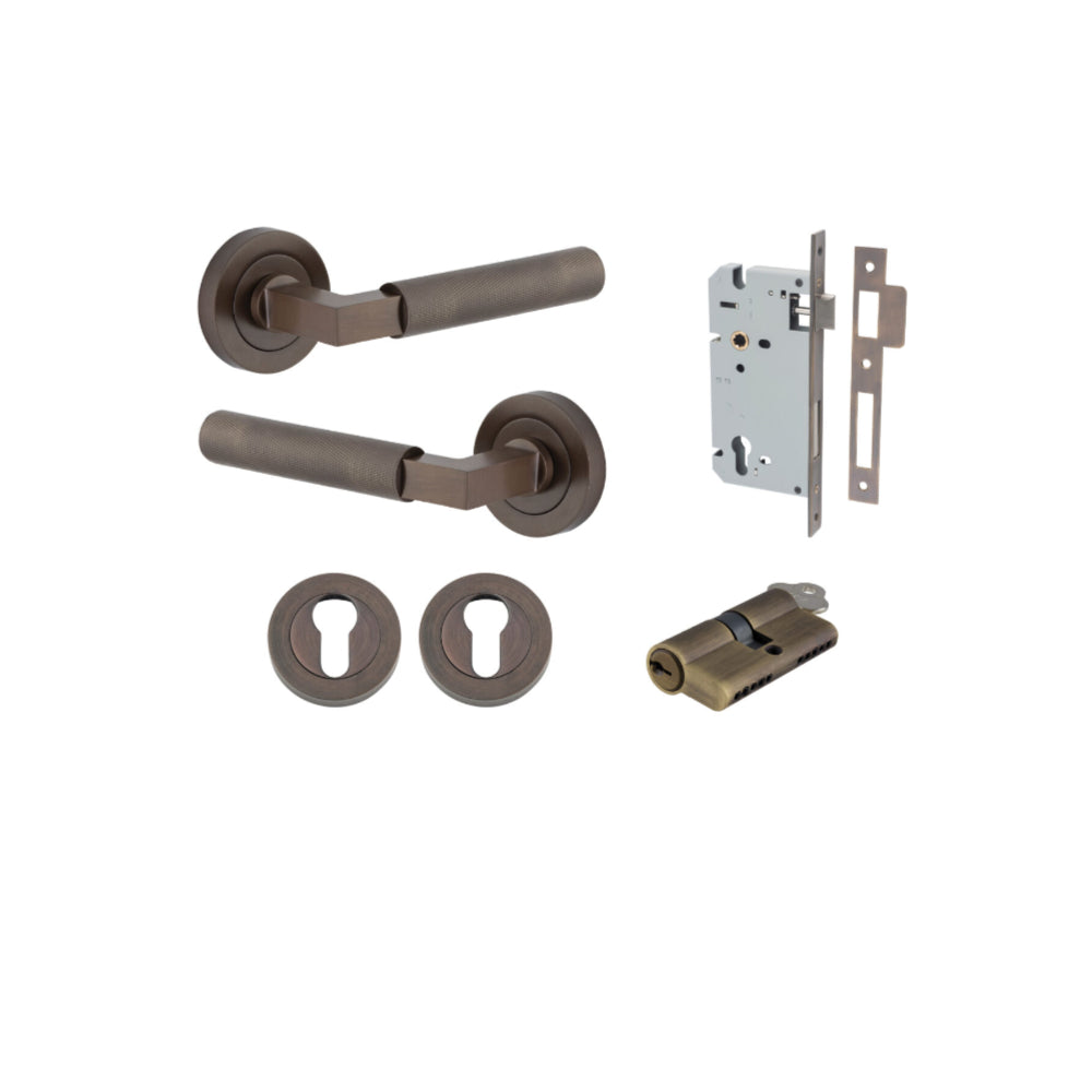 Pair of Iver Brunswick lever door handles on round rose, showcasing sleek architectural hardware in a polished finish.