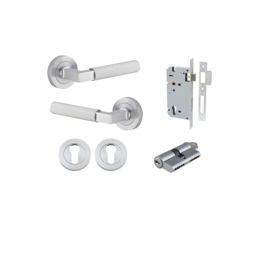 Pair of Iver Brunswick lever door handles on round rose in a sleek, modern architectural hardware design.