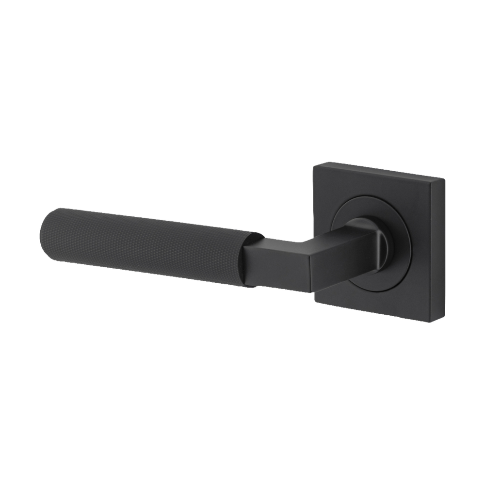 Pair of Iver architectural hardware Brunswick lever door handles on square rose, showcasing sleek metal finish and modern design.