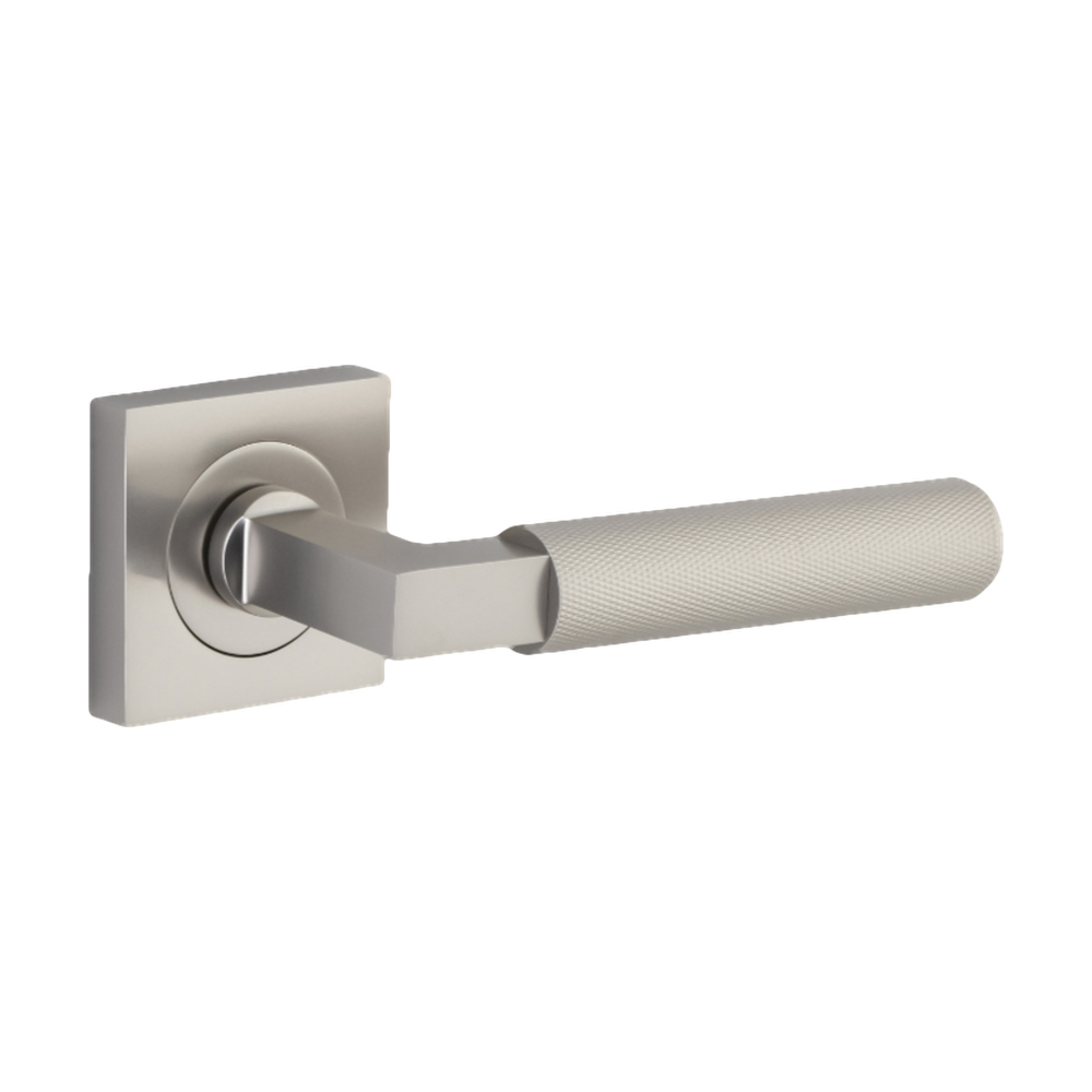 Pair of Iver Brunswick lever handles on square rose for architectural hardware, featuring a sleek, modern design.