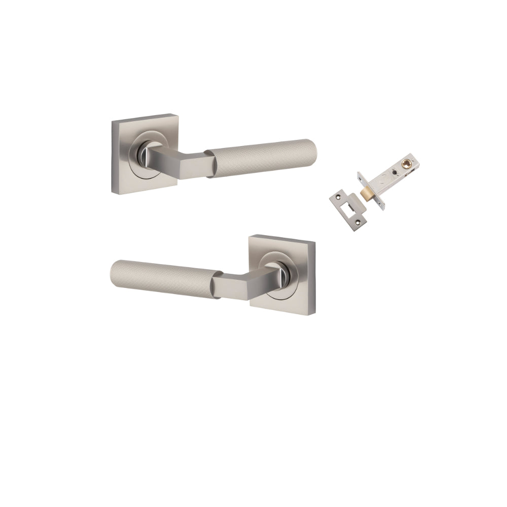 Pair of Iver Brunswick lever door handles on square rose, featuring a sleek brass finish and modern design.