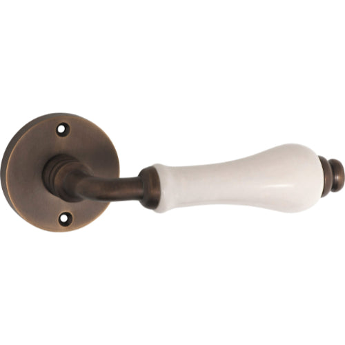Door Lever Exeter Round Rose Pair Ivory Porcelain Antique Brass D50xP66mm
(Latch/Lock Sold Separately) in Antique Brass