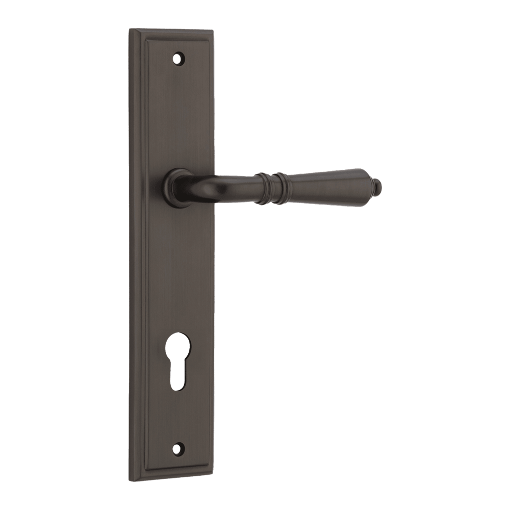 Pair of Iver Sarlat lever handles on stepped backplates, showcasing elegant design and polished finish for interior doors.