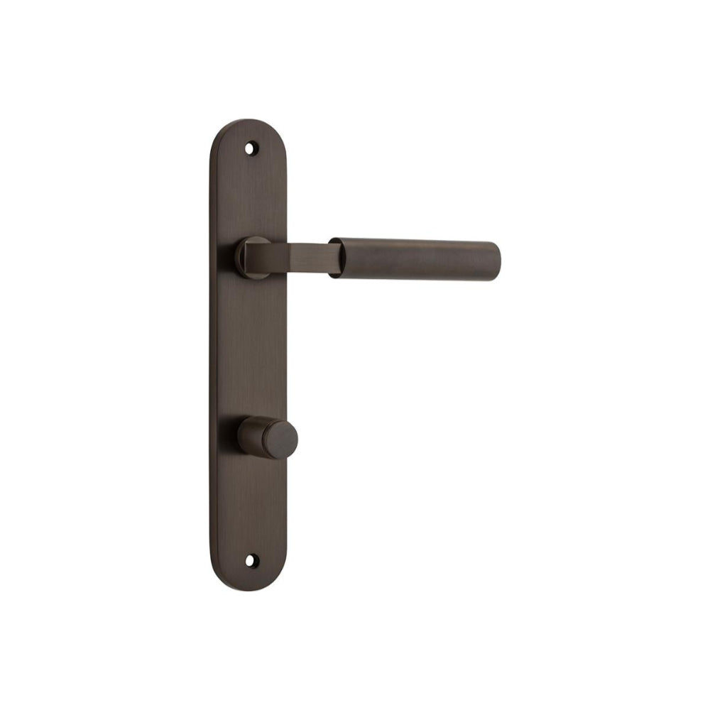 Pair of Iver Berlin lever door handles on oval backplates, featuring a sleek, modern design in polished finish