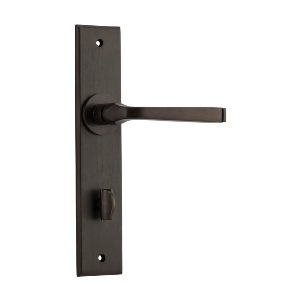 Pair of Iver Annecy lever handles on chamfered backplates for doors, showcasing elegant brass finish and modern design.