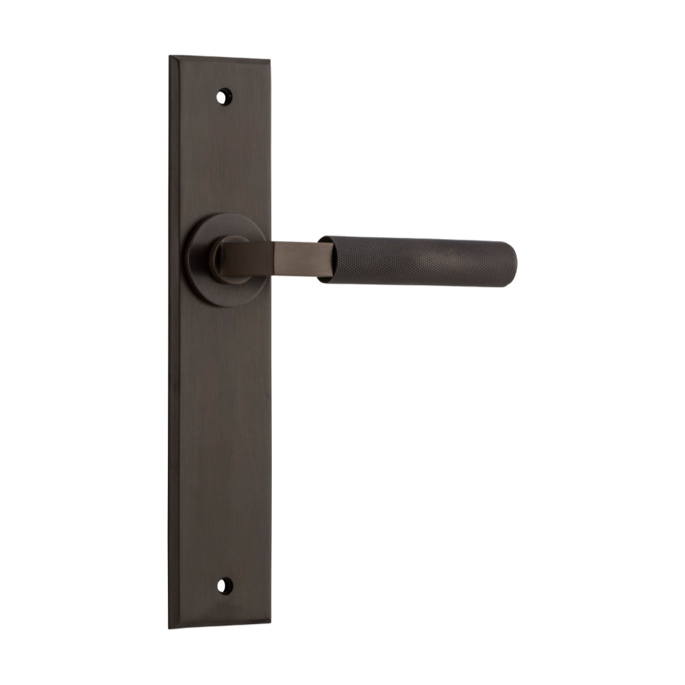 Pair of Iver Brunswick lever door handles on chamfered backplates, made of architectural hardware in a sleek, modern design.