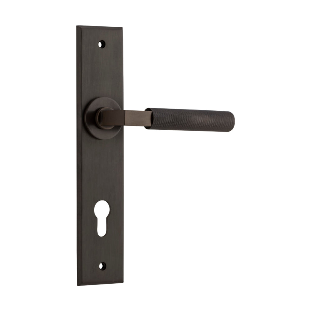 Pair of Iver Brunswick lever door handles on chamfered backplates, architectural hardware with a modern design.