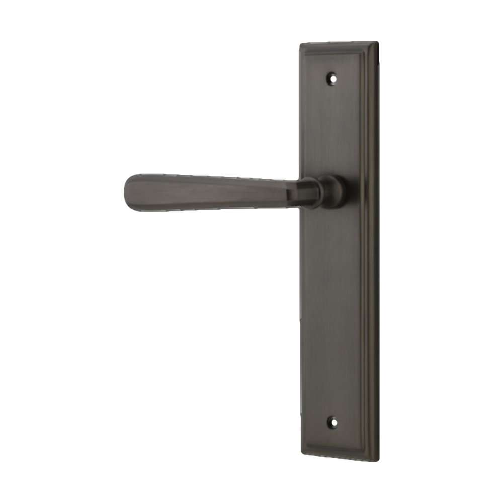 Pair of Iver Copenhagen lever door handles on stepped backplate, showcasing sleek, modern architectural hardware design.