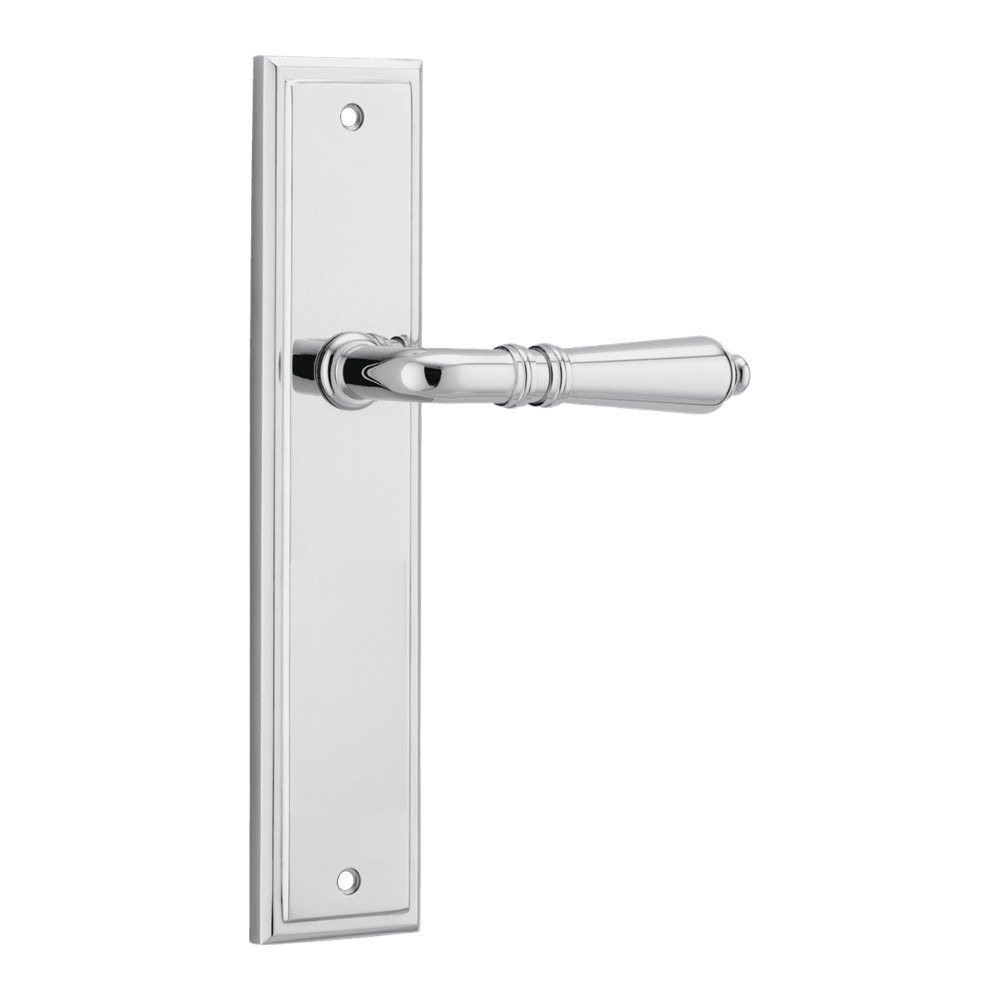 Pair of Iver Sarlat lever handles on stepped backplates, showcasing elegant brass finish and traditional design.