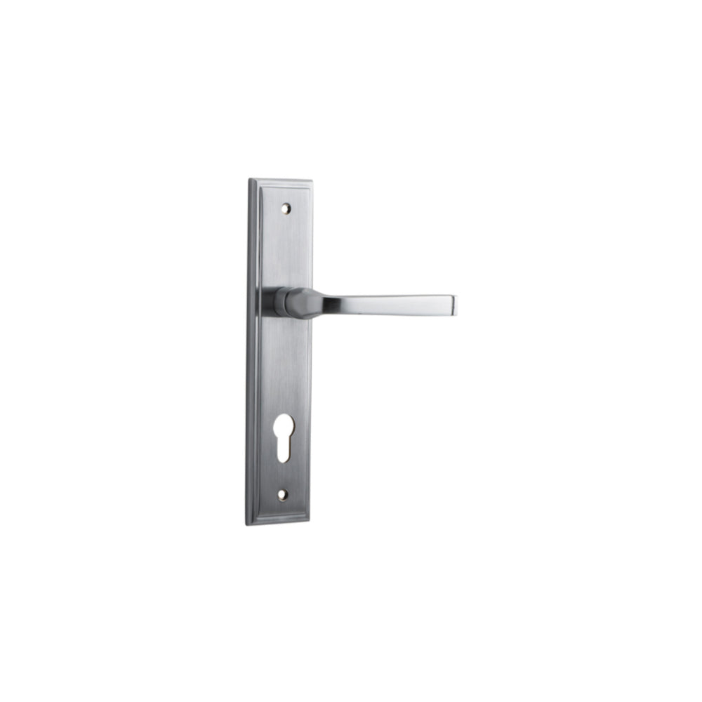 Pair of Iver Annecy lever handles on stepped backplates, showcasing elegant brushed metal finish and modern design.