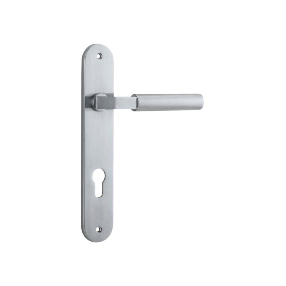 Pair of Iver Berlin lever door handles with oval backplates, showcasing sleek metallic design and modern hardware.