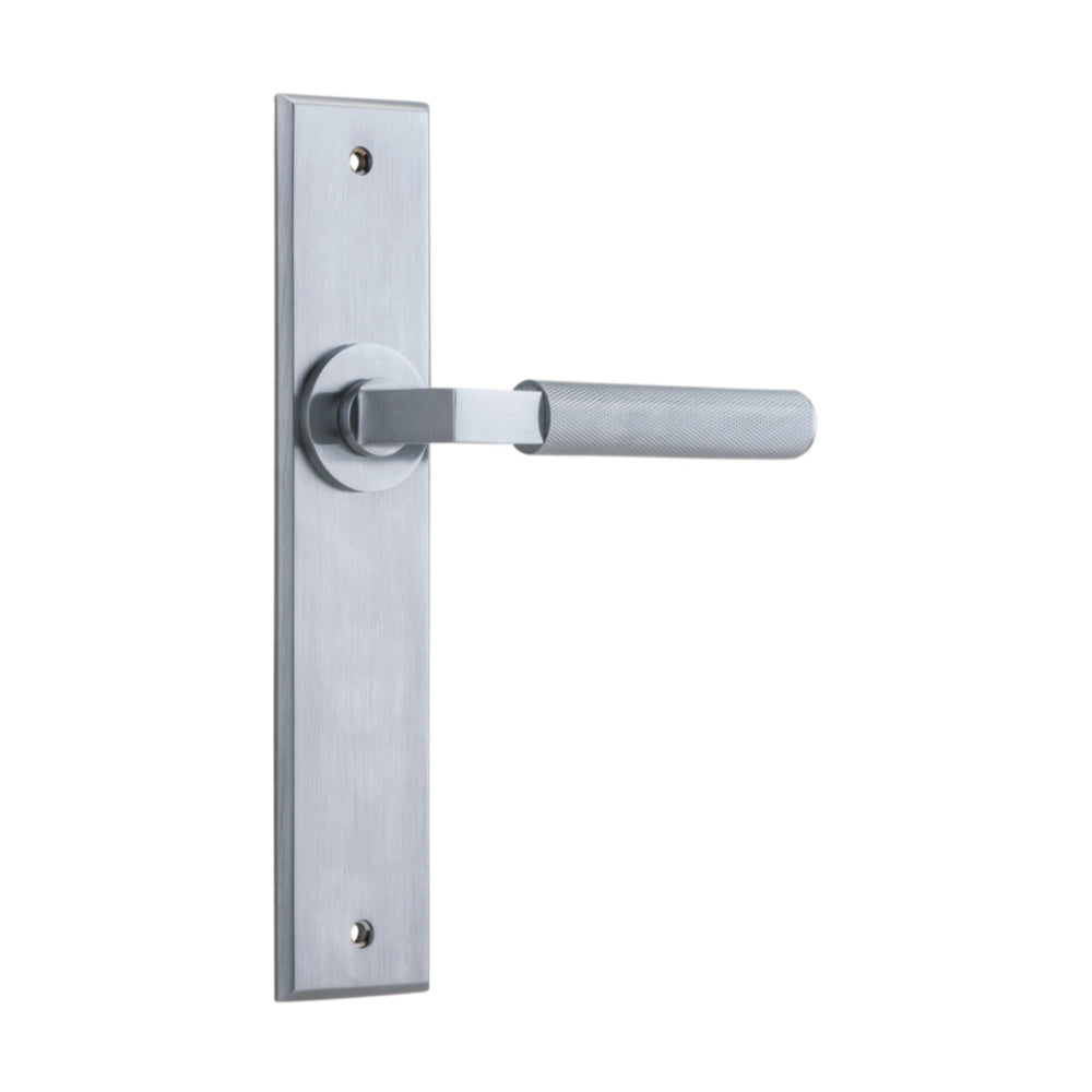 Pair of Iver Brunswick lever door handles on chamfered backplates, architectural hardware with a sleek, modern design.