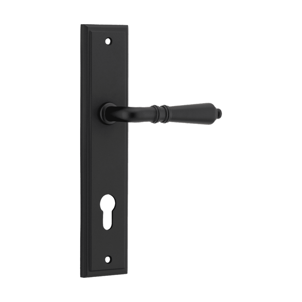 Pair of Iver Sarlat lever handles with stepped backplate, showcasing polished metal finish and elegant design.