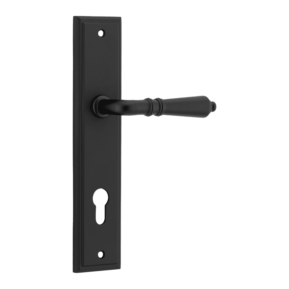 Pair of Iver Sarlat lever handles with stepped backplate, showcasing polished metal finish and elegant design.