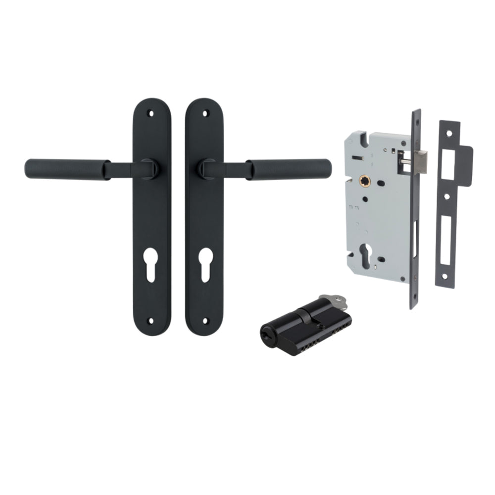 Pair of Iver Brunswick lever door handles on oval backplates, showcasing sleek architectural hardware design.