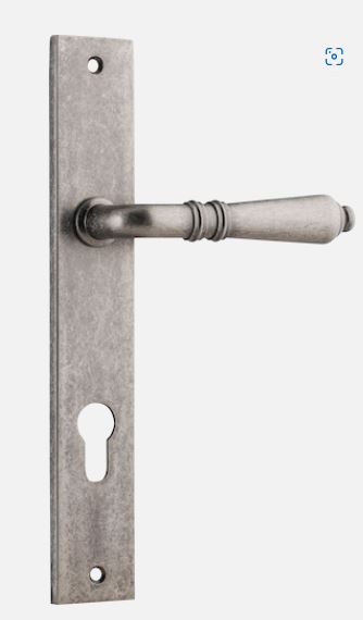 Pair of Iver Sarlat lever door handles with rectangular backplates, showcasing elegant metal hardware for interior doors.
