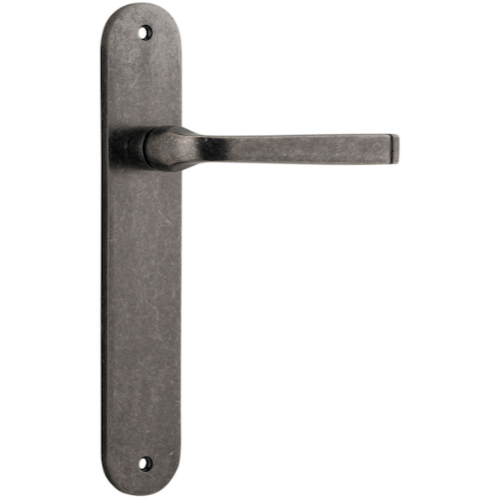 Pair of Iver Annecy lever handles on oval backplates, featuring elegant brass finish and modern design for stylish door hardware.