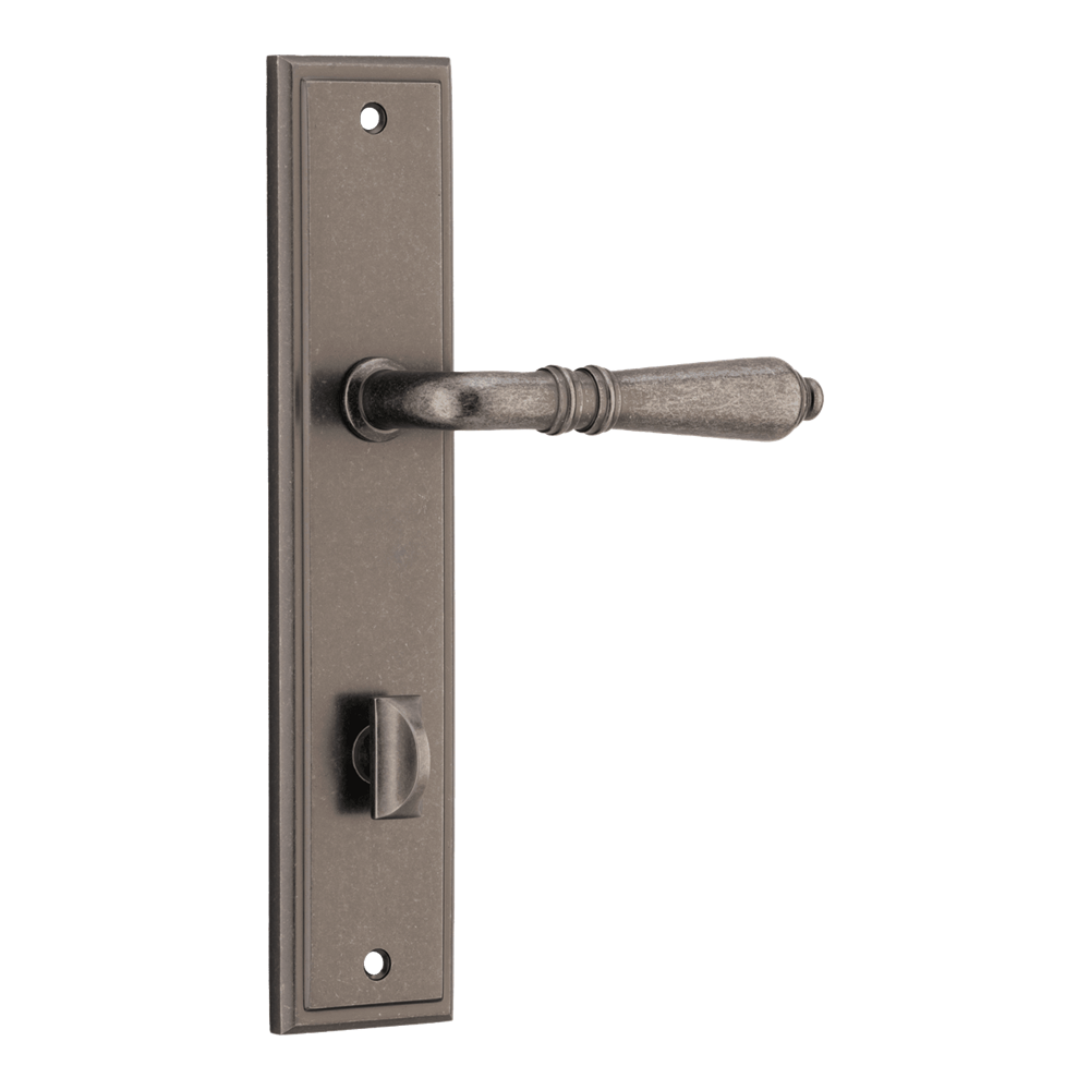 Pair of Iver Sarlat lever handles on stepped backplates, showcasing elegant door hardware with a polished finish.