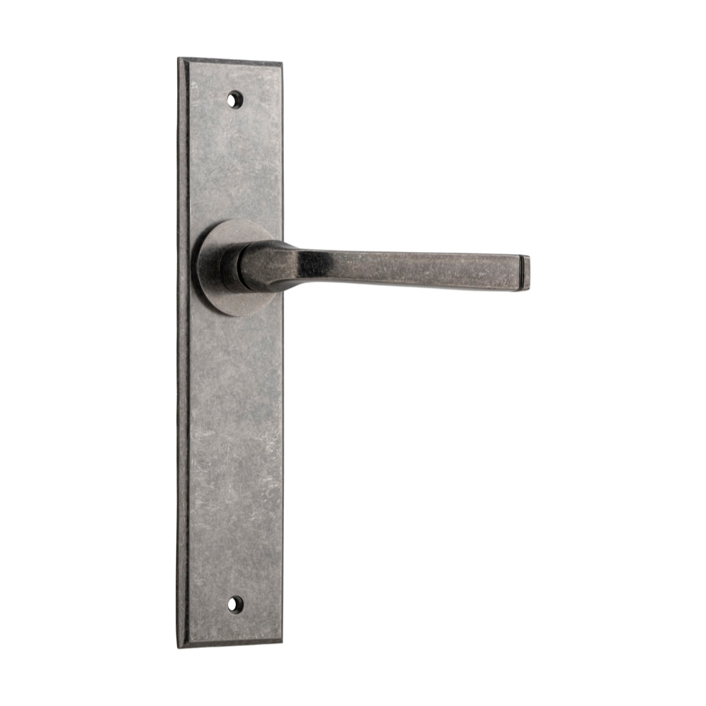 Pair of Iver Annecy lever door handles with chamfered backplates, featuring a sleek, modern design and polished finish.
