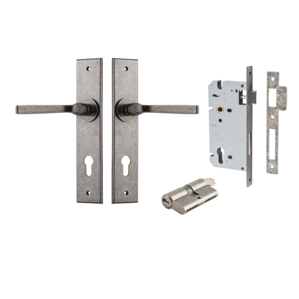 Pair of Iver Annecy lever door handles with chamfered backplates, showcasing elegant metal finish and modern design.