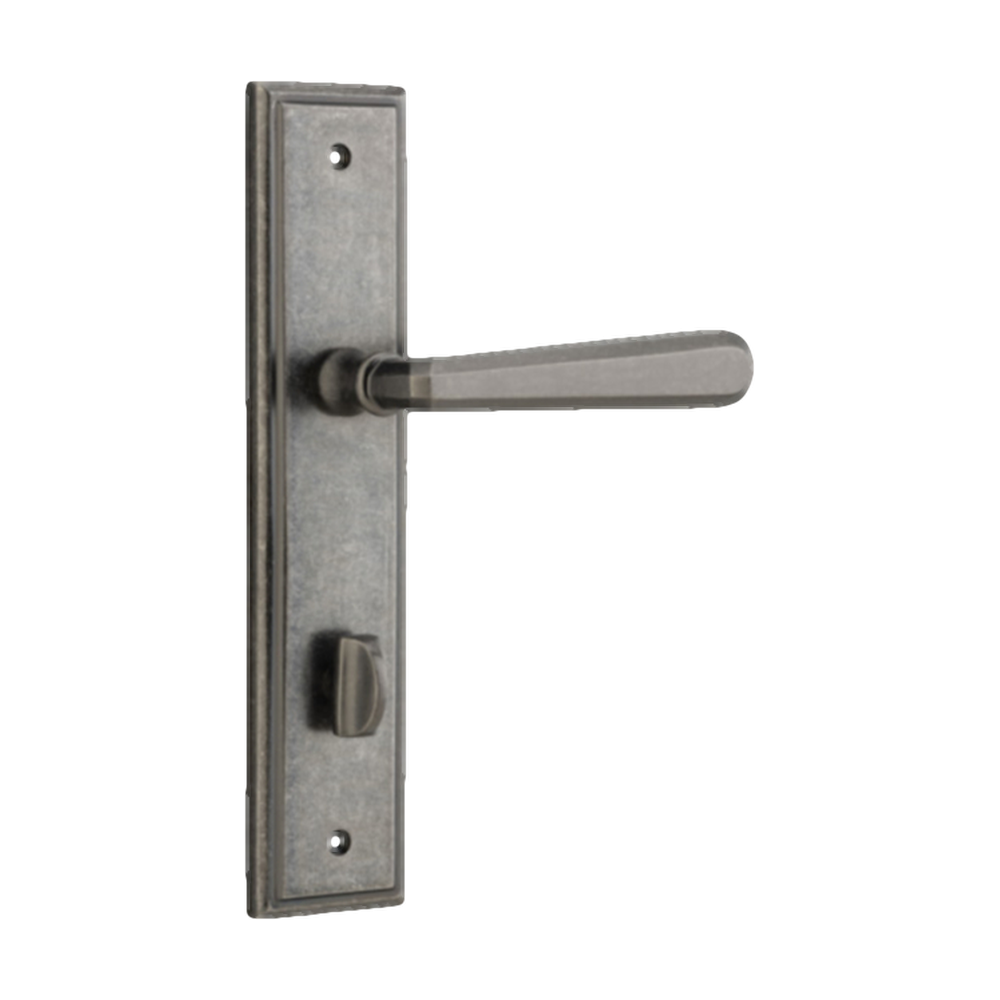Pair of Iver Copenhagen lever door handles on stepped backplates, showcasing sleek architectural hardware design.