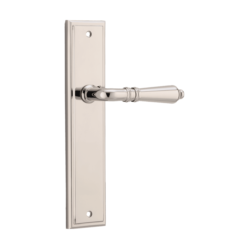 Pair of Iver Sarlat lever handles on stepped backplates, showcasing elegant, polished brass door hardware.